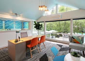 Thumbnail 18 of 30 - a dining room with a table and chairs