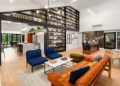 Thumbnail 2 of 27 - a living room filled with furniture and a library