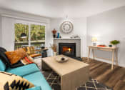 Thumbnail 5 of 27 - a living room with a fireplace and a blue couch