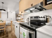 Thumbnail 10 of 27 - a kitchen with a stove top oven and a sink