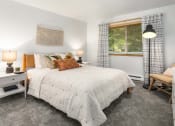 Thumbnail 20 of 27 - a bedroom with a bed and a window