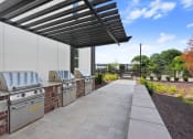 Thumbnail 14 of 27 - the preserve at ballantyne commons outdoor kitchen with stainless steel appliances