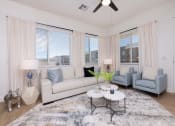 Thumbnail 19 of 59 - spacious living room with large windows and ceiling fan at Element 12 Apartments, Henderson NV