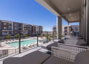 Thumbnail 46 of 59 - a view of the pool from the balcony of a condo at Element 12 Apartments, Henderson NV