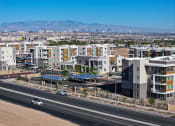 Thumbnail 59 of 59 - an aerial view of a city with buildings and a highway at Element 12 Apartments, Henderson NV