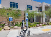 Thumbnail 9 of 59 - an electric vehicle charging station in front of a building at Element 12 Apartments, Henderson NV