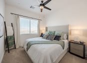 Thumbnail 23 of 59 - a bedroom with a bed and a ceiling fan at Element 12 Apartments, Henderson NV