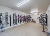 Thumbnail 8 of 59 - a room with many bikes hanging on the wall at Element 12 Apartments, Henderson NV
