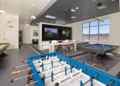 Thumbnail 38 of 59 - a games room with a pool table and a television at Element 12 Apartments, Henderson NV