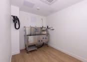 Thumbnail 41 of 59 - a room with a machine in the corner of it at Element 12 Apartments, Henderson NV
