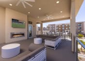 Thumbnail 7 of 59 - Outdoor Balcony resident lounge with fireplace and large screen televisioni at Element 12 Apartments, Henderson NV