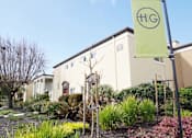 Thumbnail 36 of 55 - a building with a flag in front of it at Hillsdale Garden Apartments, CA, 94403