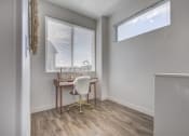 Thumbnail 12 of 42 - an office space with a desk and a window