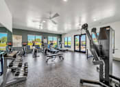 Thumbnail 5 of 30 - Modern fitness center with cardio and strength equipment at The Charles