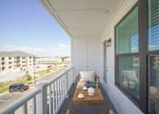 Thumbnail 7 of 30 - Private apartment balcony overlooking the landscaped community at The Charles