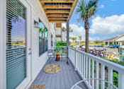Thumbnail 9 of 30 - Private apartment balcony overlooking the landscaped community at The Charles