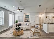 Thumbnail 14 of 30 - Bright apartment living room with large windows and contemporary furnishings