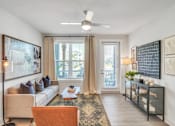 Thumbnail 22 of 30 - Modern apartment living room with television, sofa and contemporary furnishings
