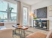 Thumbnail 23 of 30 - Modern apartment living room with television, sofa and contemporary furnishings