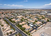 Thumbnail 7 of 63 - A suburban neighborhood with a road running through it.