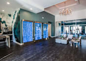 Thumbnail 21 of 63 - A room with a large painting on the wall and a chandelier hanging from the ceiling.