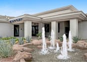 Thumbnail 53 of 58 - a fountain in front of a building