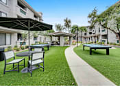 Thumbnail 46 of 58 - picnic area with tables chairs and umbrellas