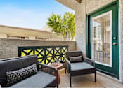 Thumbnail 30 of 58 - a balcony with two chairs and a table