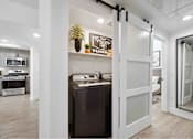 Thumbnail 29 of 58 - a sliding barn door separates the Washer/Dryer from the living room