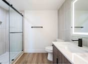 Thumbnail 14 of 58 - a bathroom with a sink toilet and a shower