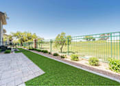 Thumbnail 23 of 58 - a backyard with green grass and a fence