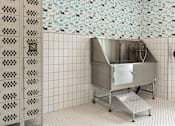 Thumbnail 26 of 79 - A stainless steel sink in a tiled bathroom.