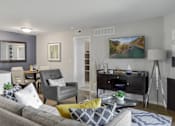 Thumbnail 3 of 30 - Open space living room with sofas and dining area at The Villas at Northstar apartments in Ann Arbor, MI