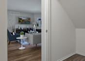 Thumbnail 12 of 30 - A living room with a grey sofa and a white coffee table.