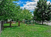 Thumbnail 20 of 30 - A green sign with the word "Olympic" on it is in the foreground of a grassy area.