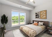 Thumbnail 11 of 61 - A bedroom with a large bed and a view of the outdoors through a large window.