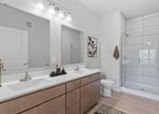 Thumbnail 37 of 61 - A bathroom with a white sink and a toilet.