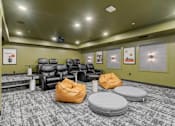 Thumbnail 29 of 61 - A room with a carpeted floor and a row of chairs.