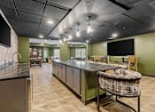 Thumbnail 52 of 61 - A kitchen with a black ceiling and a green wall.