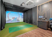 Thumbnail 41 of 76 - A golf simulation room at The Lodge at Overland luxury apartments in Rochester, MN.