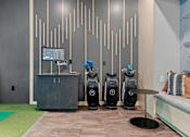 Thumbnail 43 of 76 - A room with a wall of vents and a row of vacuum cleaners.