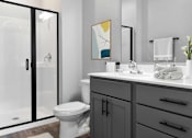 Thumbnail 76 of 76 - A bathroom with a toilet, sink, and a glass shower door.