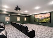Thumbnail 25 of 32 - A home theater with a large screen and comfortable seating.