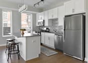 Thumbnail 2 of 30 - Open concept kitchen at Park 205 Apartments in Park Ridge, IL