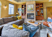 Thumbnail 32 of 43 - Resident lounge with a fireplace and artwork at Riverset Apartments in Memphis, TN.