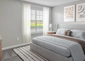 Thumbnail 19 of 43 - Bedroom with large bed window at Riverset Apartments for rent Memphis, TN.