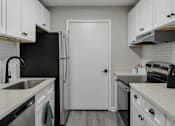 Thumbnail 17 of 43 - Modern kitchen at Riverset Apartments in Memphis, TN