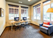 Thumbnail 40 of 43 - A room with two computers and a couch.