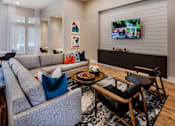 Thumbnail 11 of 36 - Resident lounge with entertainment space and ample seating