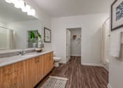 Thumbnail 17 of 36 - Spacious bathroom with dual sinks and ample storage
